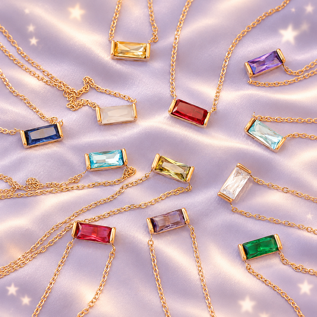 Alternate styled image: Birthlight CZ color options on lilac satin. One necklace per order; AI-created setting.