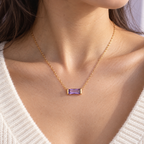 AI-generated on-body styling image of Birthlight CZ Birthstone Necklace — Rose & Clay. Shown: Gold · February-color CZ. Illustrative fit; see original product photos and measurements.