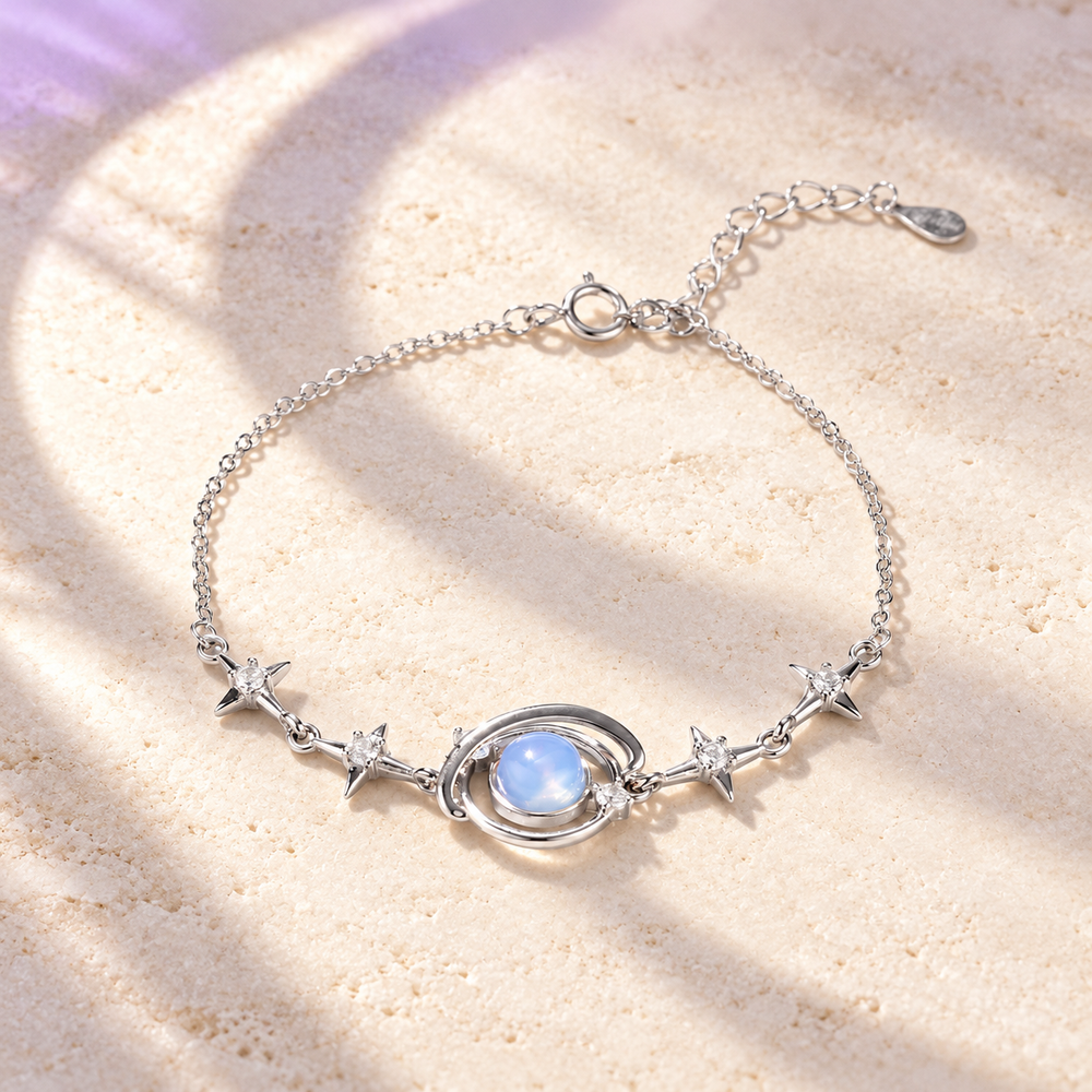 Styled editorial image of Starry Orbit Bracelet; celestial setting.