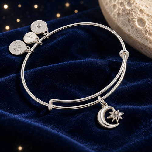 Styled editorial image of ALEX AND ANI Moon & Star Charm Bangle; AI-created celestial setting. See original product photos for product reference.