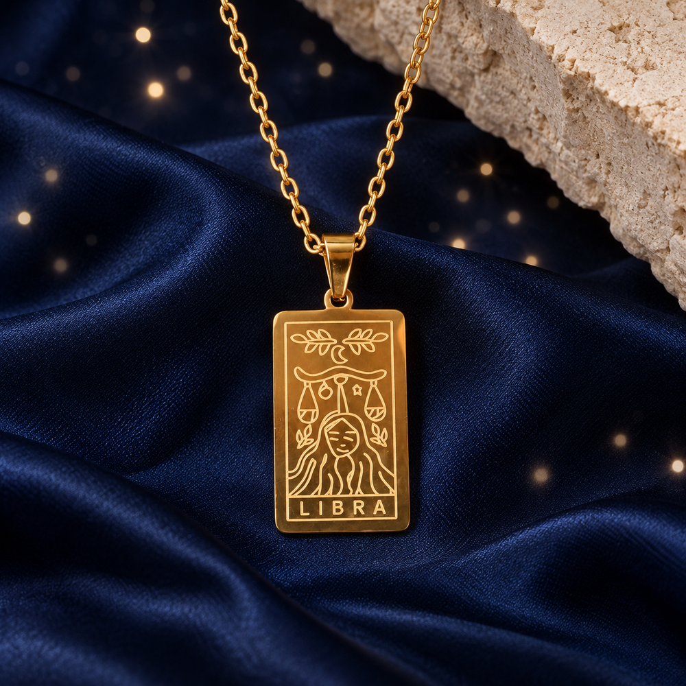Styled editorial image of the Gold Libra option of the Rose & Clay reversible zodiac necklace; AI-created celestial setting. Original product photos retained.