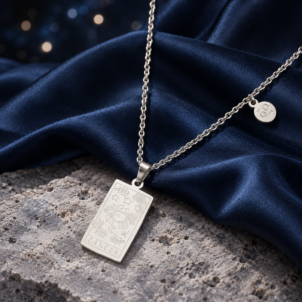 Styled editorial image of Zodiac Sign Necklace; celestial setting.