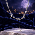 Styled editorial image of Shooting Star Necklace; AI-created setting. Original product photo also included.