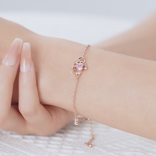 Lunar Pink Heart Bracelet shown worn in motion.
