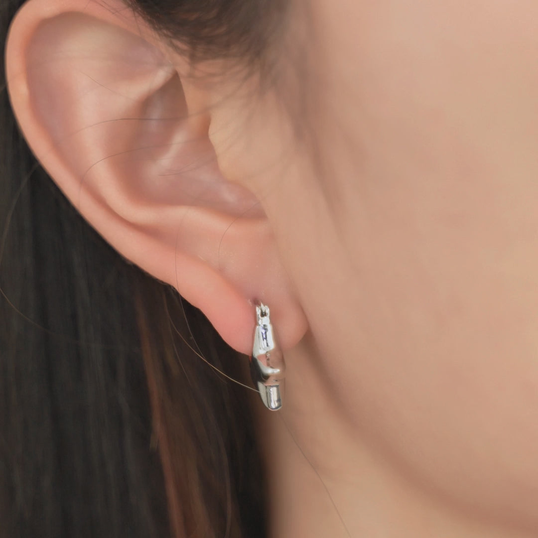 Starlit Star Hoops shown worn in motion.